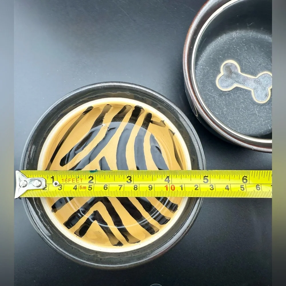 2 small dog dishes. Chic tiger print and bone print. 5”